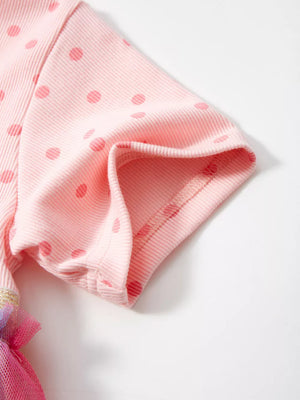 Pink polka dot toddler dress with ribbed short sleeves and rainbow tulle skirt detail.