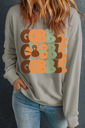 Gray crewneck sweatshirt with stacked "Gobble" text and a turkey graphic.