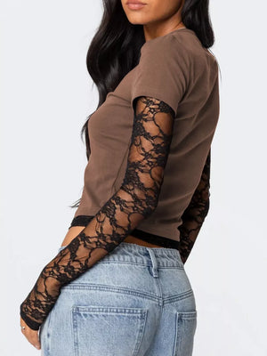 Brown cropped t-shirt with black lace long sleeves and trim.