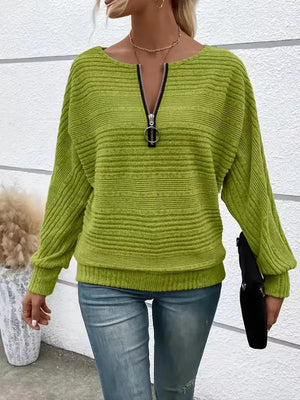 Sage ribbed quarter zip sweatshirt with O-ring pull and dolman sleeves.
