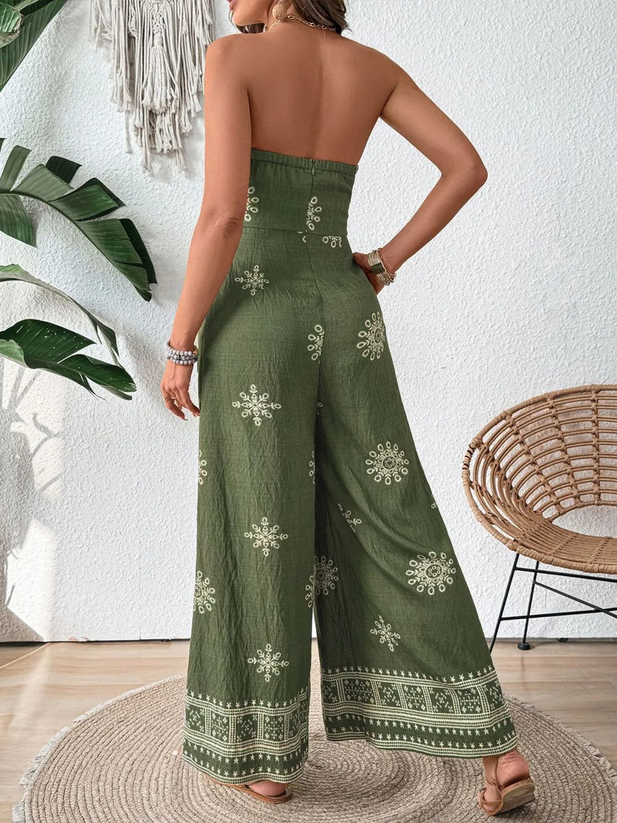 Matcha green bandeau wide-leg jumpsuit with embroidered floral pattern and border detail.