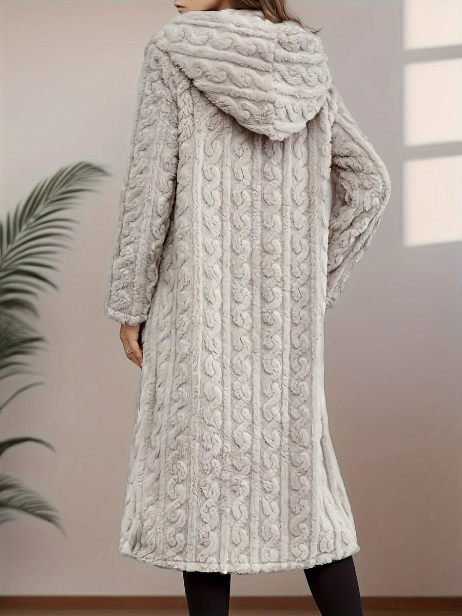 Gray hooded longline outerwear with cable knit texture and a soft, fuzzy finish.