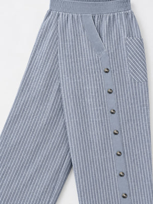 wide-leg pants in light blue with striped and decorative button