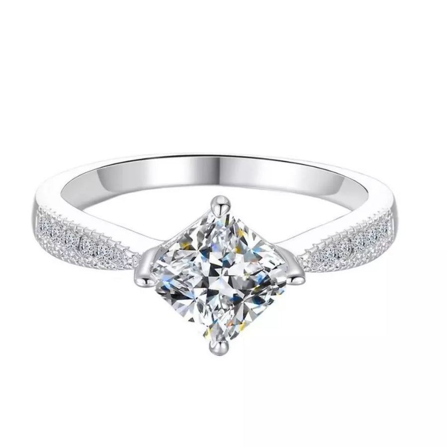 Sterling silver ring with princess-cut moissanite and pave band.