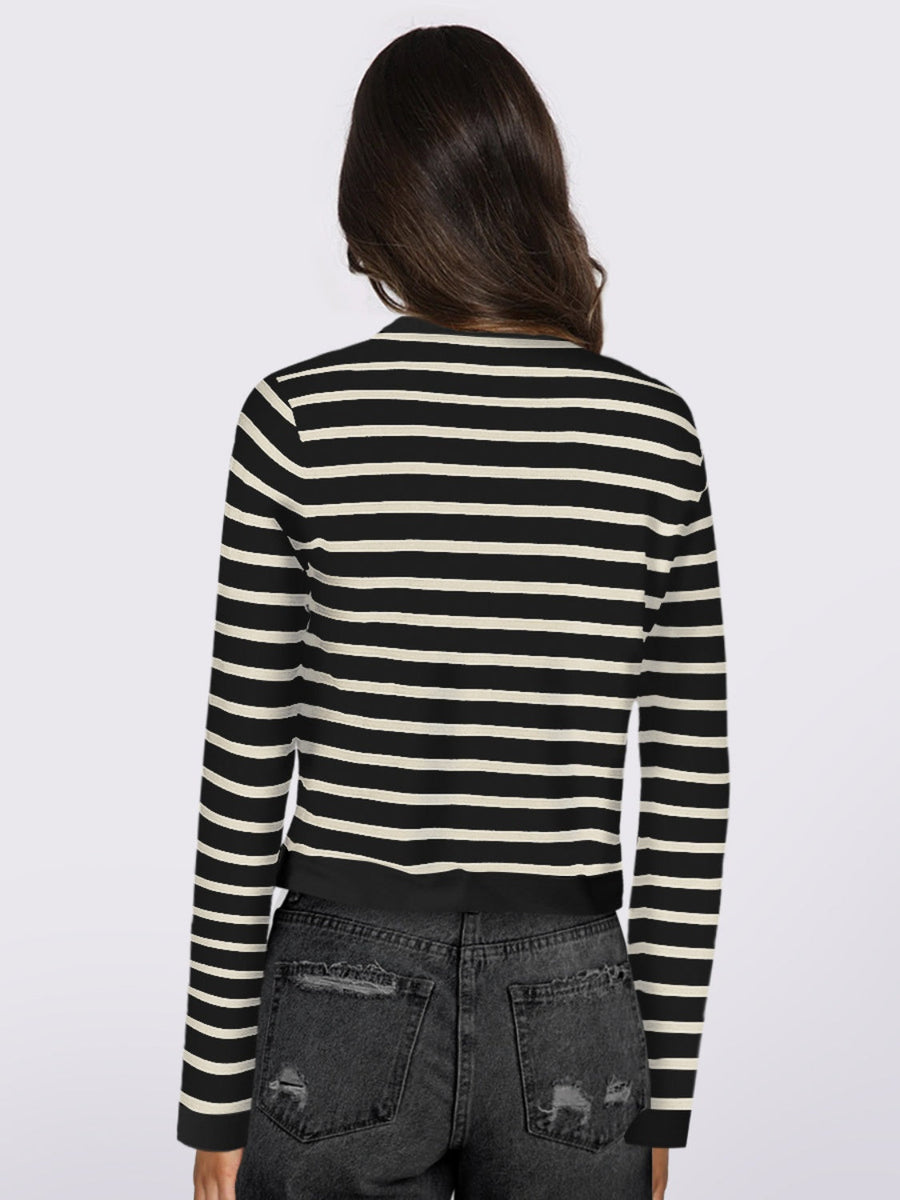 Black and white striped cropped cardigan with long sleeves.