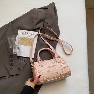 Pink crossbody bag with cartoon bear and bunny pattern