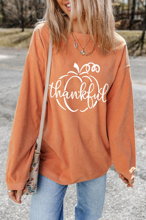 Corduroy sherbet sweatshirt with white pumpkin graphic and thankful text.