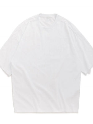 Oversized white crew neck t-shirt with textured fabric and short sleeves.