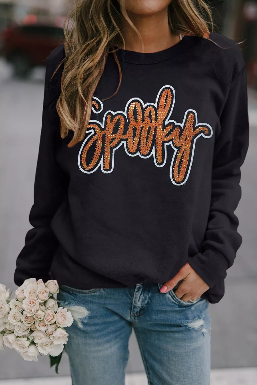 50% polyester, 50% cotton Care instructions: Machine wash cold sweatshirt in Black with relaxed silhouette