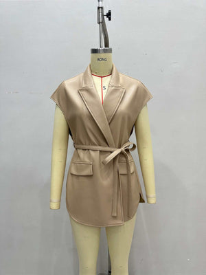 vest in black with belted and hip-length