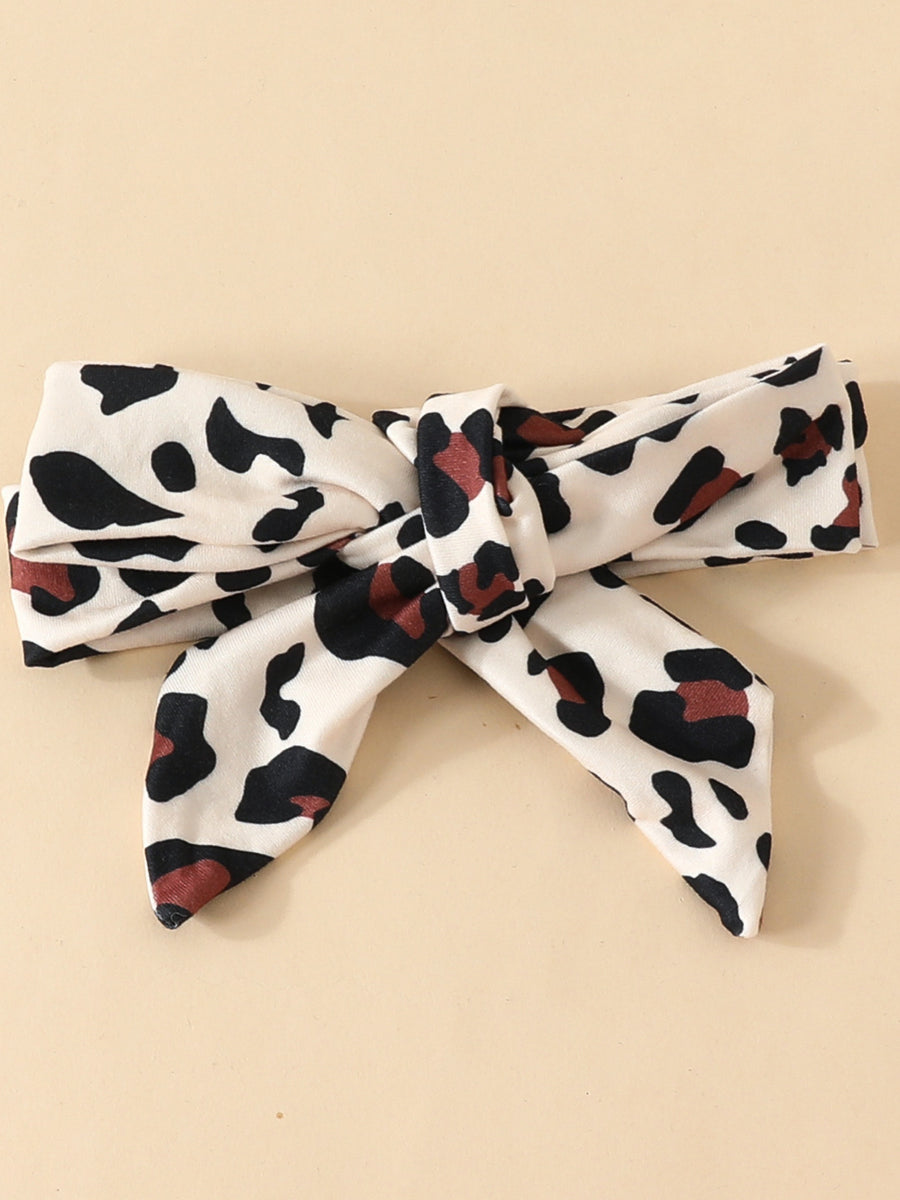 Baby headband with leopard print and bow detail, 100% polyester