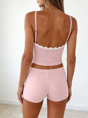 Blush pink cami and shorts set with white lace trim.