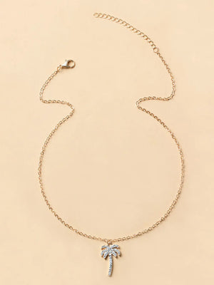 necklace featuring palm tree motif in clear with lace texture