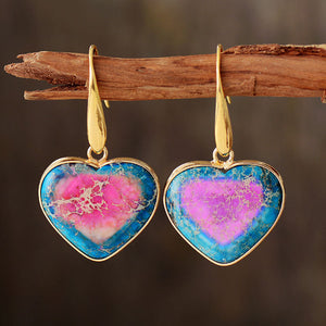 Heart-shaped jasper and gold earrings with blue and pink marbled stone detail.