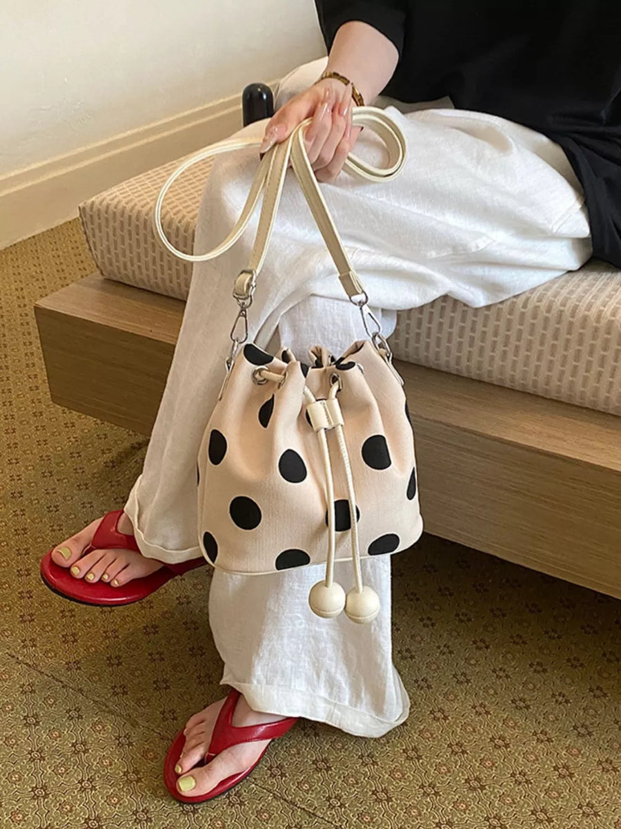 crossbody bag featuring polka dot in cream with PU Leather Imported Size & texture