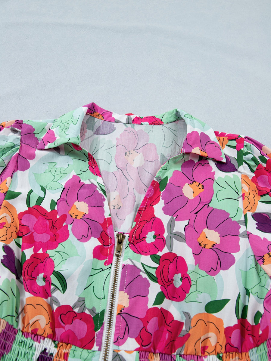 Floral V-neck zip midi dress with colorful floral print and smocked waist detail.