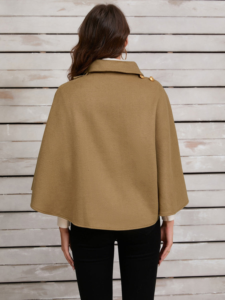Camel cape jacket with gold buttons and asymmetric front detail.