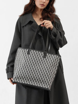 black tote featuring top handles and geometric