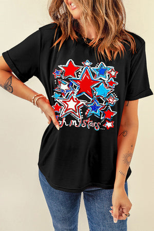 Black t-shirt with rolled sleeves featuring a red, white, and blue starburst graphic and text.
