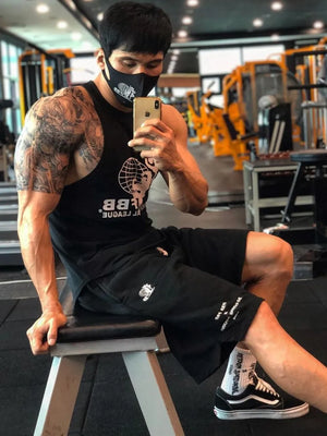 Black performance fleece jogger shorts with white logo detail.