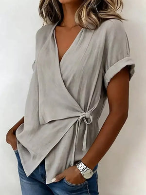 100% polyester Care instructions: Machine wash cold wrap top in Mocha with relaxed silhouette