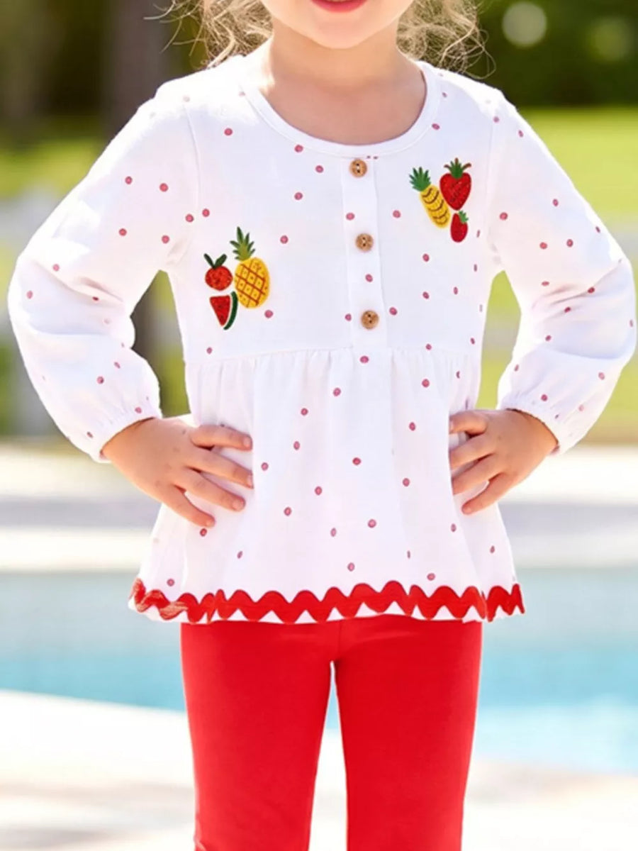 red peplum top featuring embroidered and polka dot