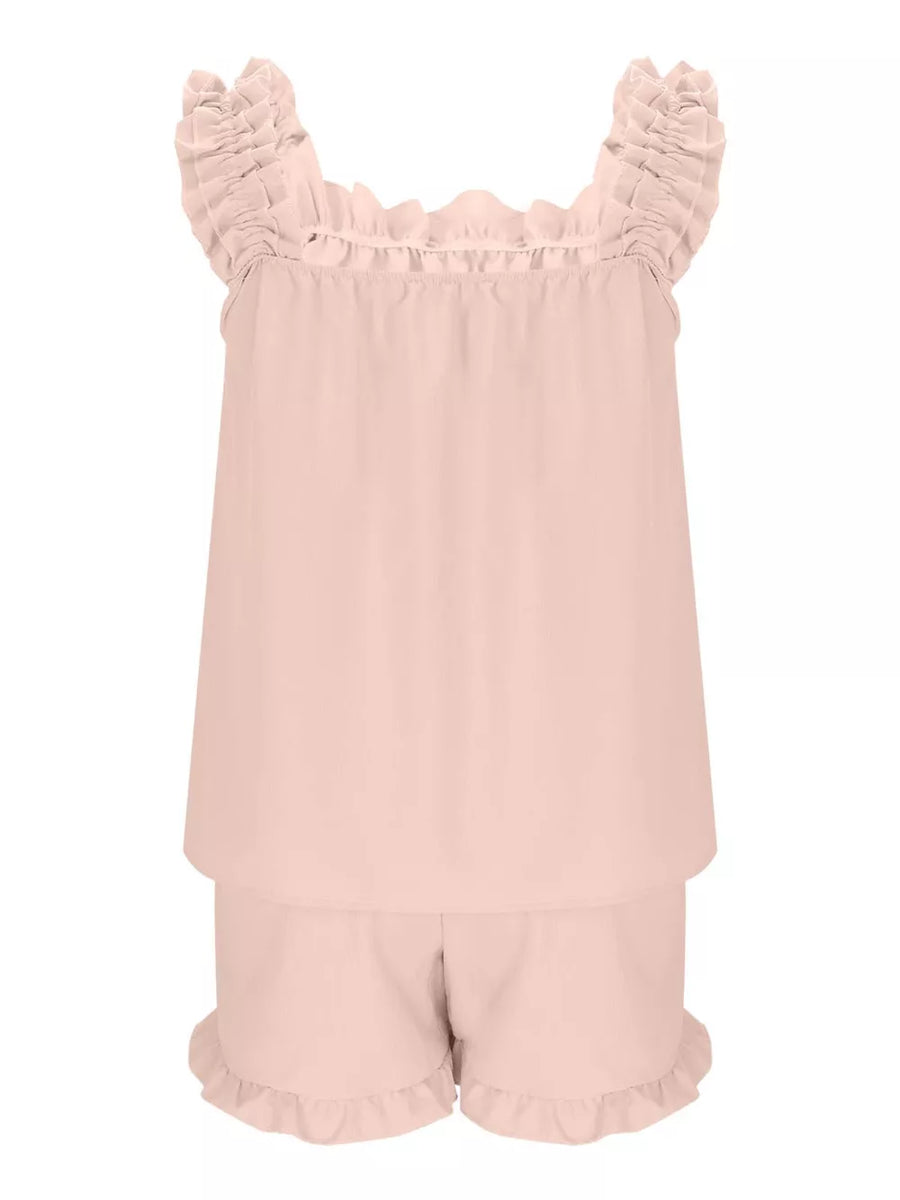 Pale blush ruffled pajama set with square neckline and ruffled shorts.