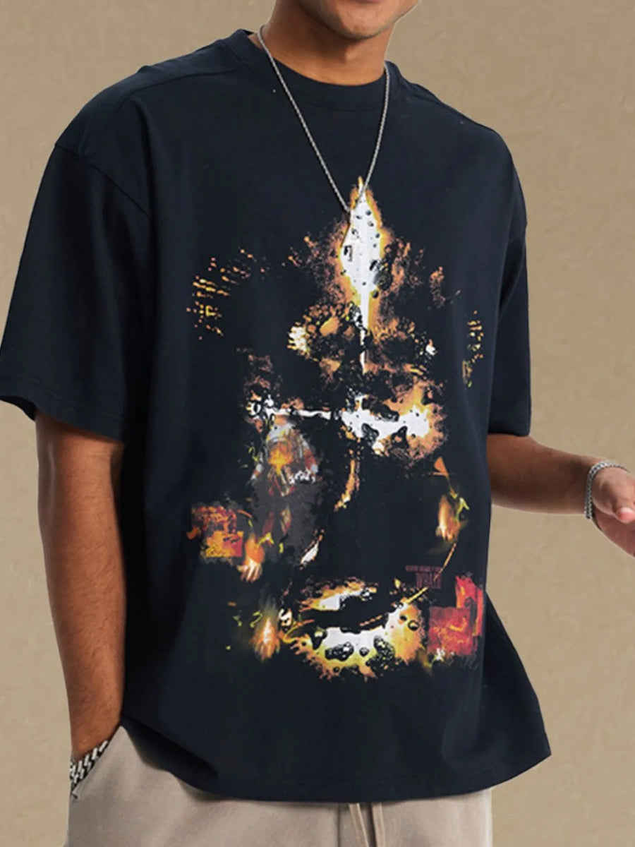 Black oversized t-shirt with abstract fiery graphic print.