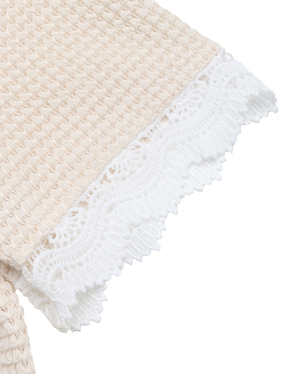 Apricot waffle knit maternity tee with white lace trim detail on sleeve.