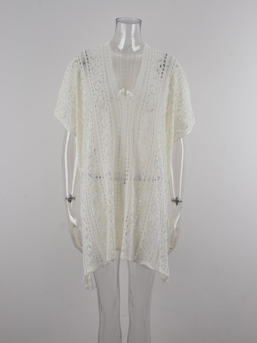 White open-knit V-neck beach cover-up with short sleeves and a tasseled hem.