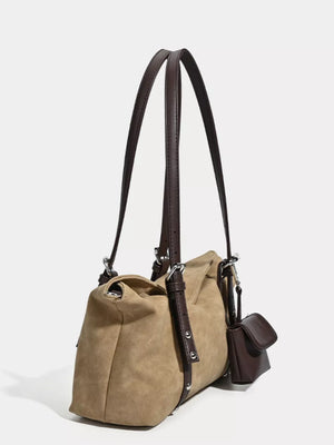 Brown suede medium shoulder bag with adjustable straps and a small attached pouch.