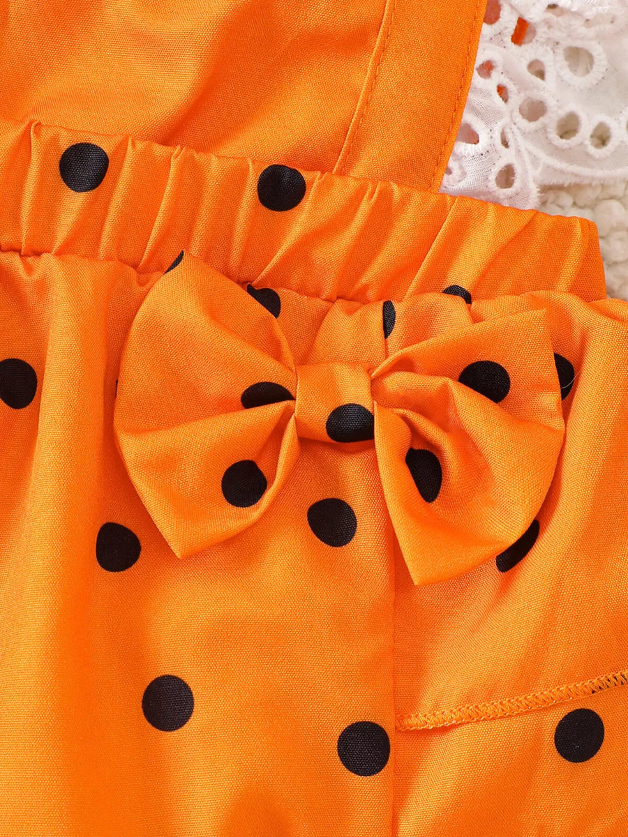 orange romper with bow and ruffle sleeve
