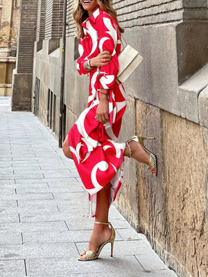Red abstract patterned shirt dress with 3/4 sleeves and waist tie, midi length