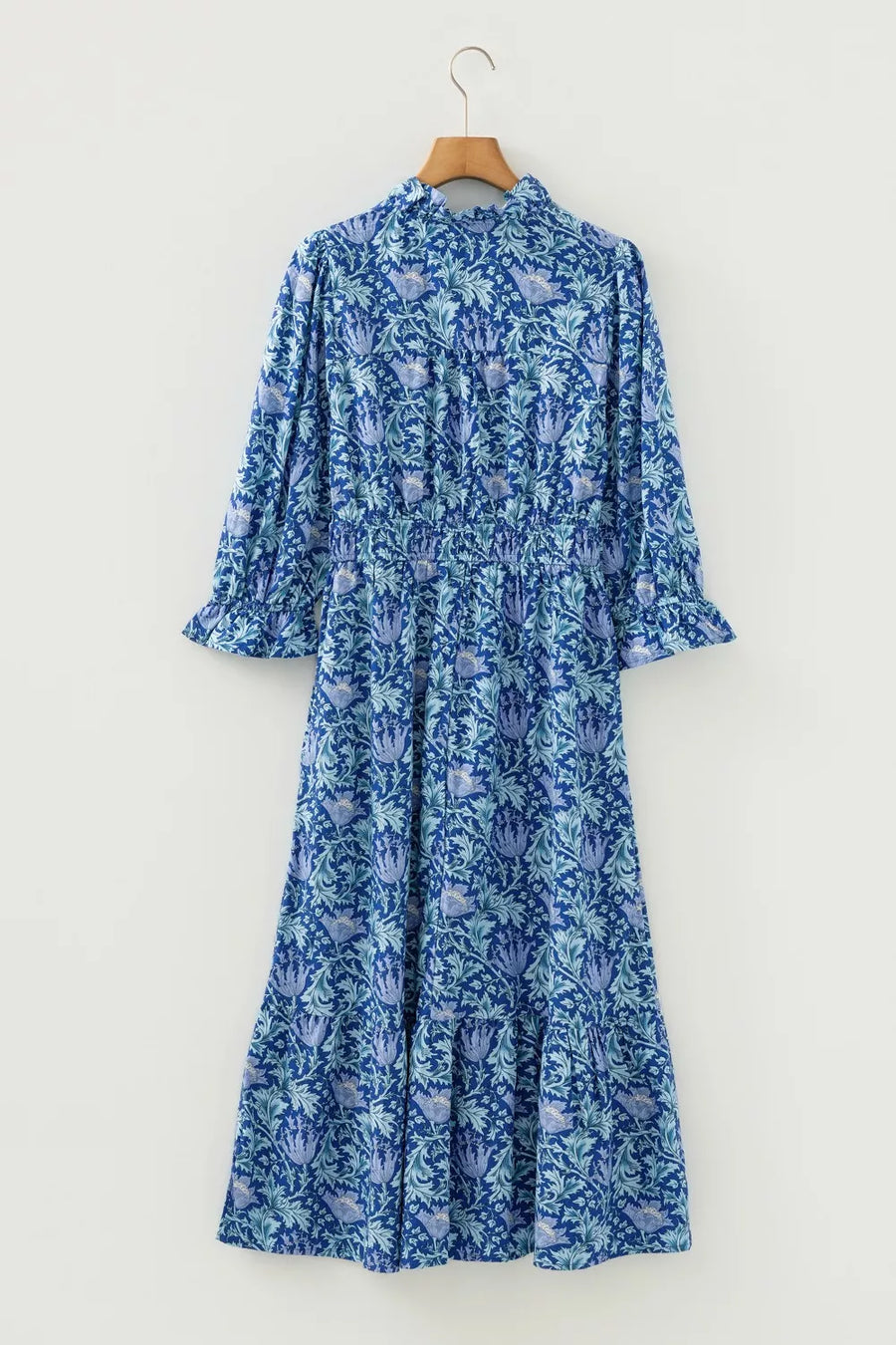 Blue floral midi dress with cinched waist and frilled cuffs