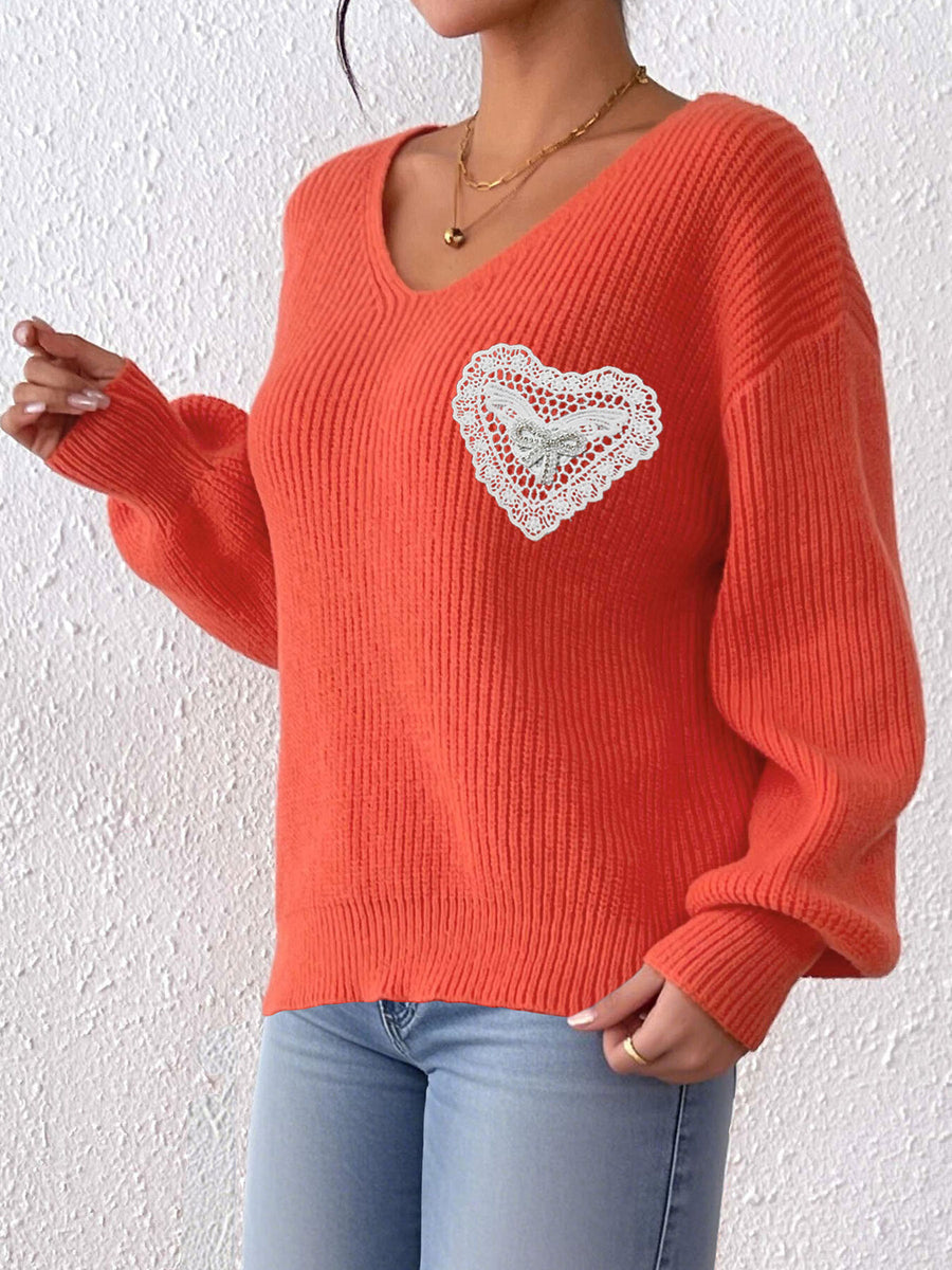 100% polyester Care instructions: Machine wash cold pullover sweater in Orange with relaxed silhouette