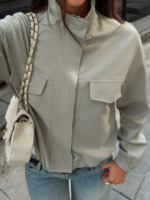 windbreaker in sage green featuring zipper and relaxed fit