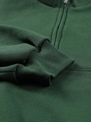 Dark green half zip sweatshirt with stand collar and ribbed cuffs.