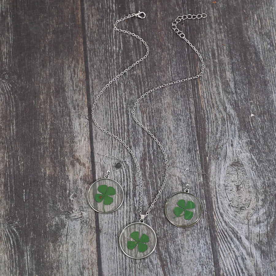 Pressed clover resin jewelry set with silver chain necklace and matching earrings.