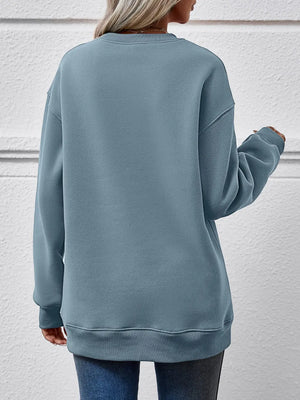 Misty Blue 100% polyester drop shoulder sweatshirt with crewneck and ribbed cuffs and hem.
