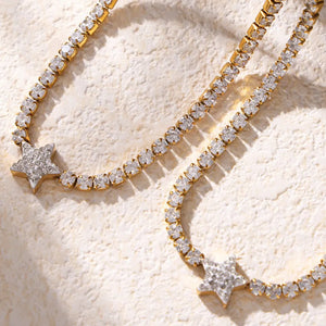 Gold celestial starburst pavé choker necklace with clear stones.