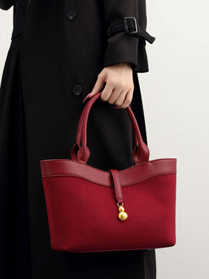 Suede Crossbody Bag With Gold Charm in Wine Red with adjustable strap