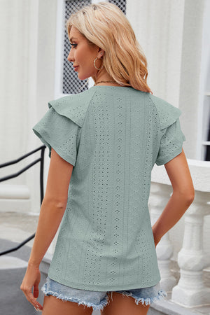 Sage eyelet flutter sleeve blouse with ruffled shoulders and short sleeves.