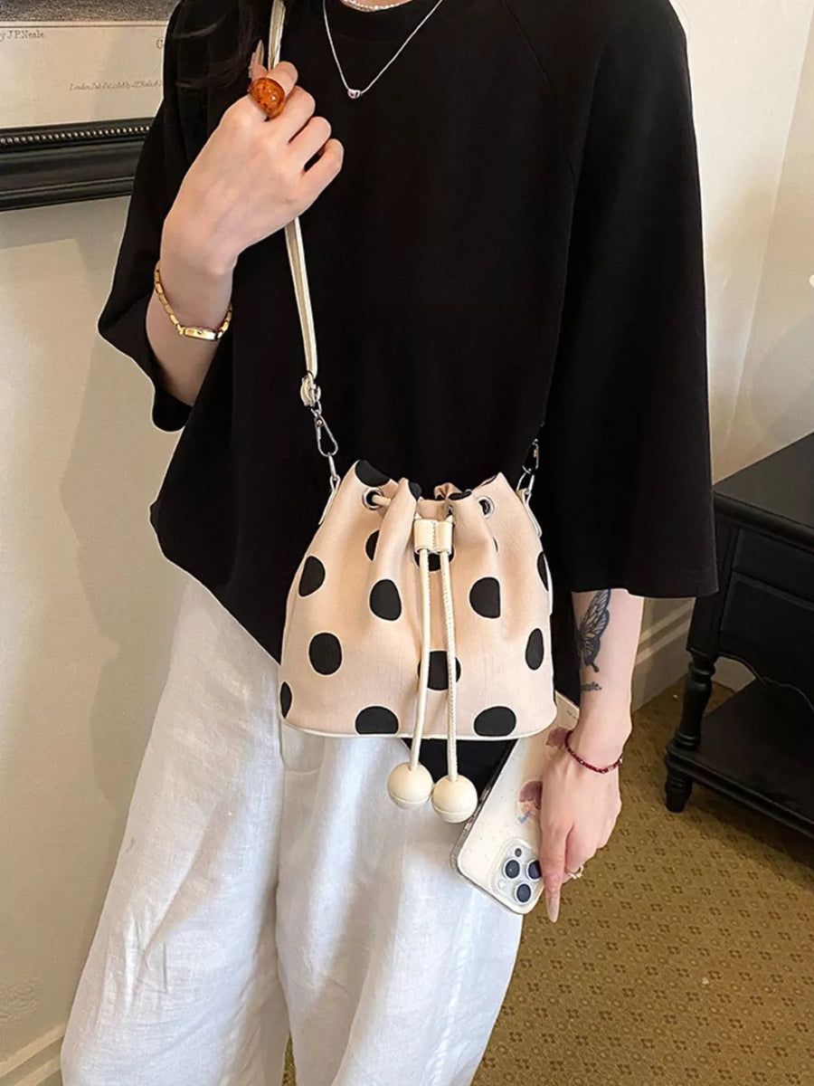 crossbody bag featuring polka dot in black with PU Leather Imported Size & texture