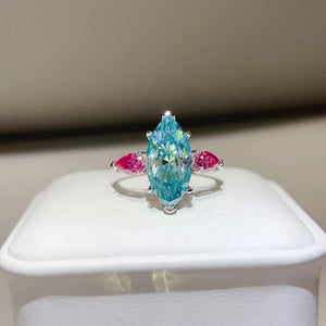 ring in aqua featuring moissanite stones and elongated fit
