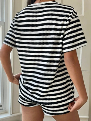 Waffle knit two-piece loungewear set in black and white stripes. Crew neck, short sleeves, and shorts.