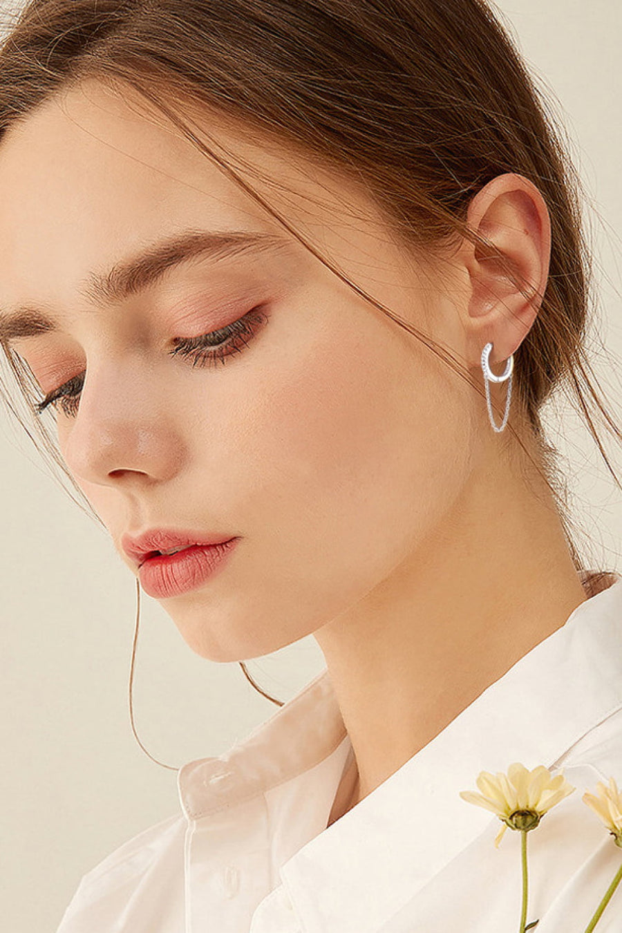 Silver dangling chain pavé huggie earrings with delicate sparkle
