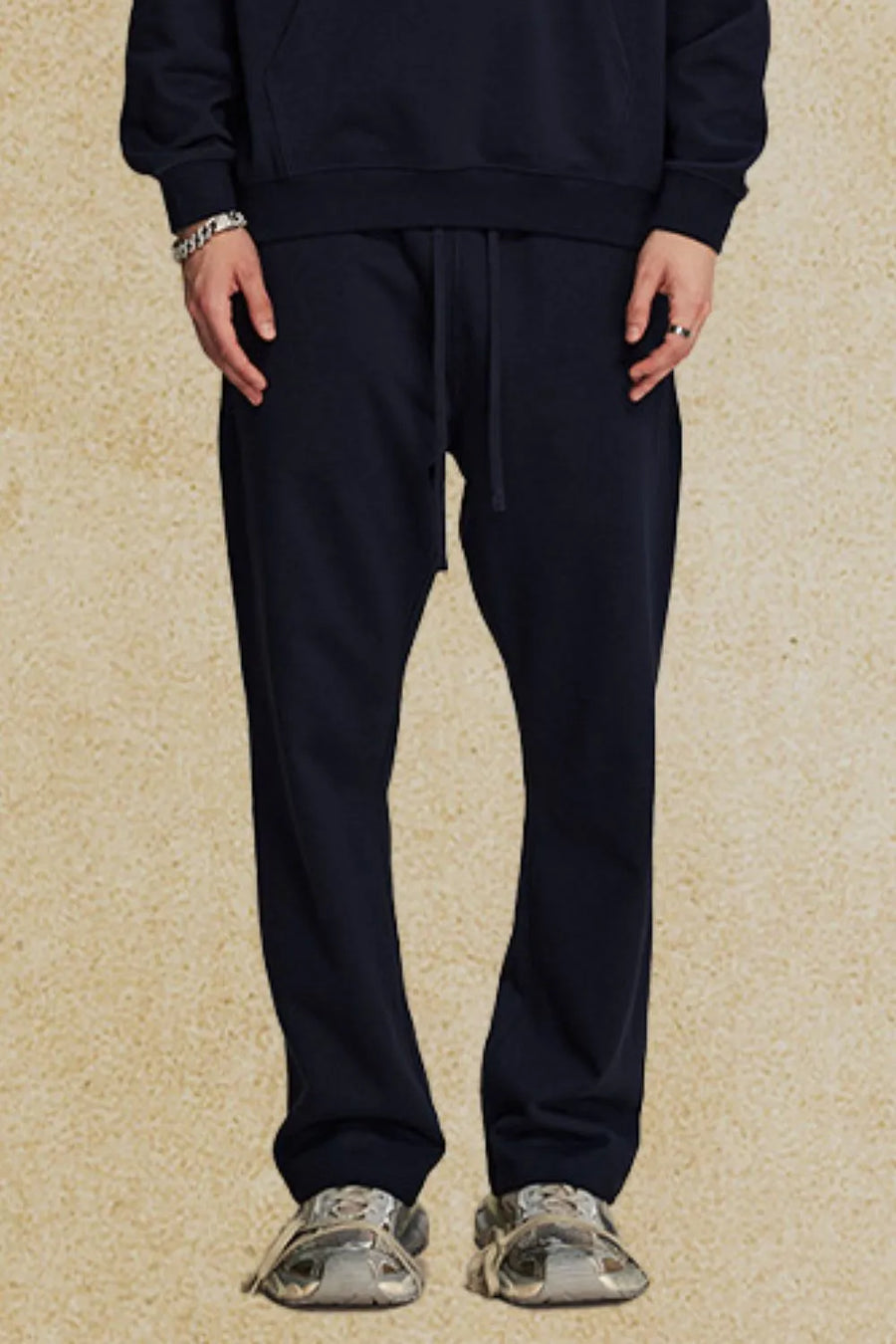 Navy relaxed fit lounge joggers with drawstring waist and cuffed ankles.