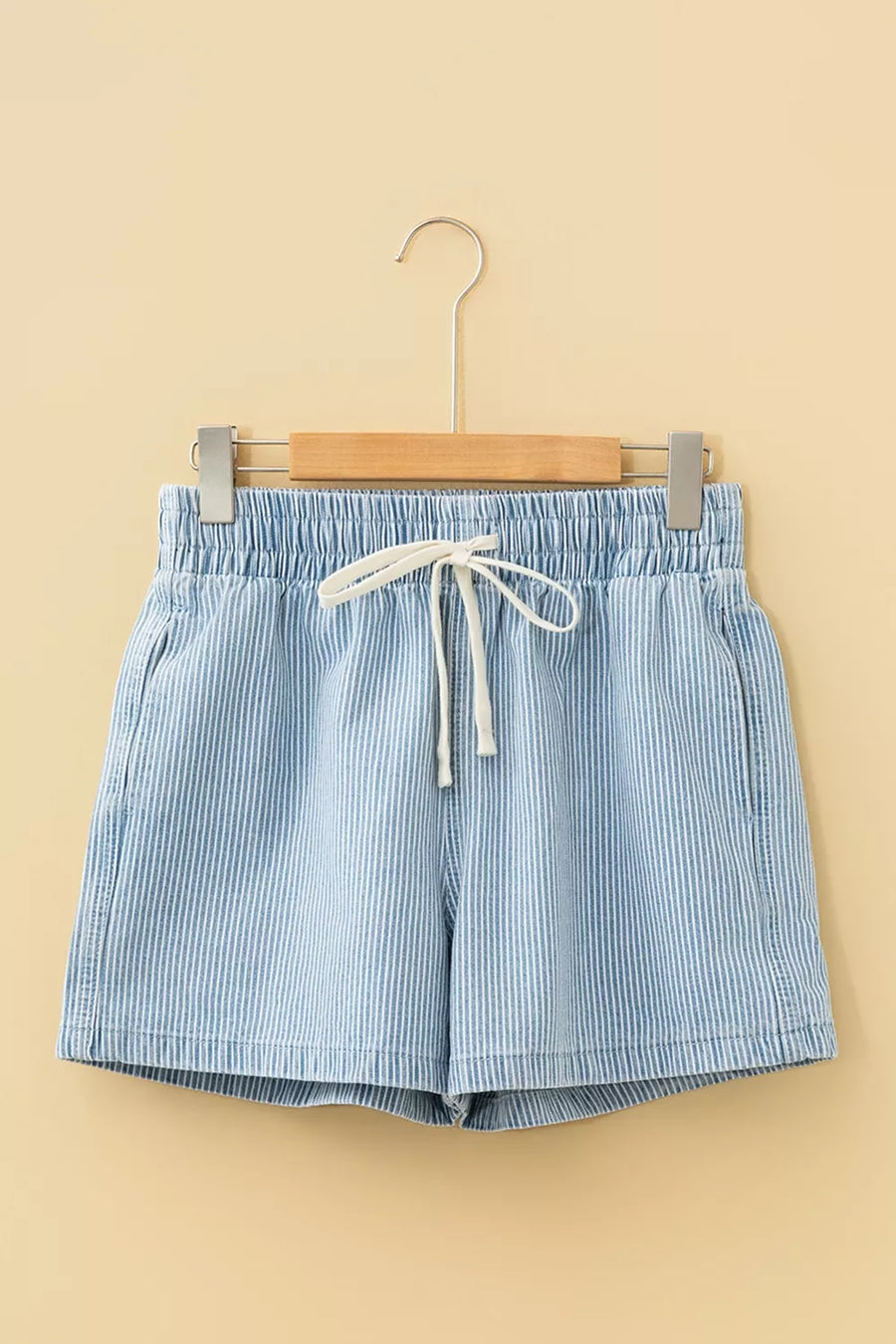 Relaxed fit denim shorts with white pinstripes and a drawstring waist.