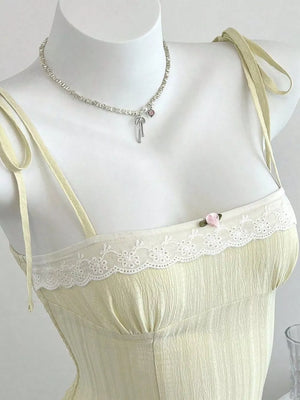 100% polyester Care instructions: Machine wash cold camisole in Burgundy with fitted silhouette