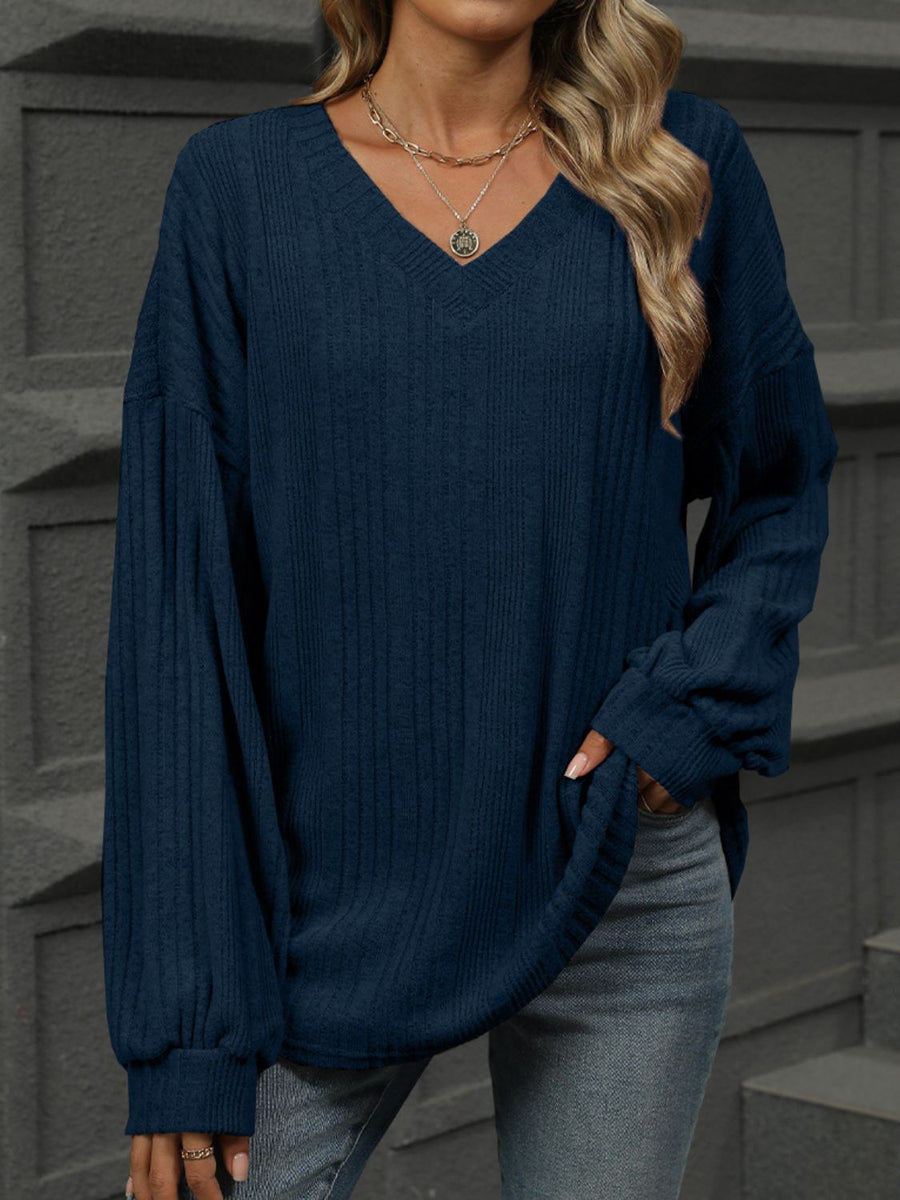Dark Navy textured ribbed v-neck blouse with blouson sleeves and a relaxed fit.